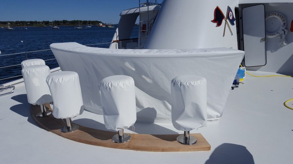 Clean white bar covers in place on yacht