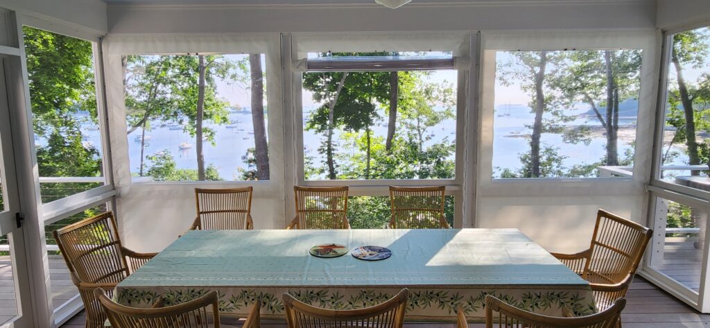 View of Camden harbor from a porch with Summer panels in place. 