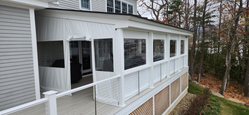 Porch enclosure with door panel for outdoor access.