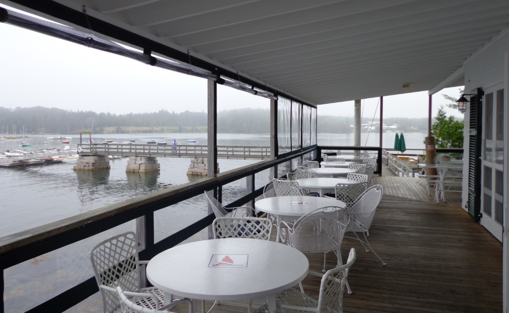 Yacht club porch enclosed from the rain.