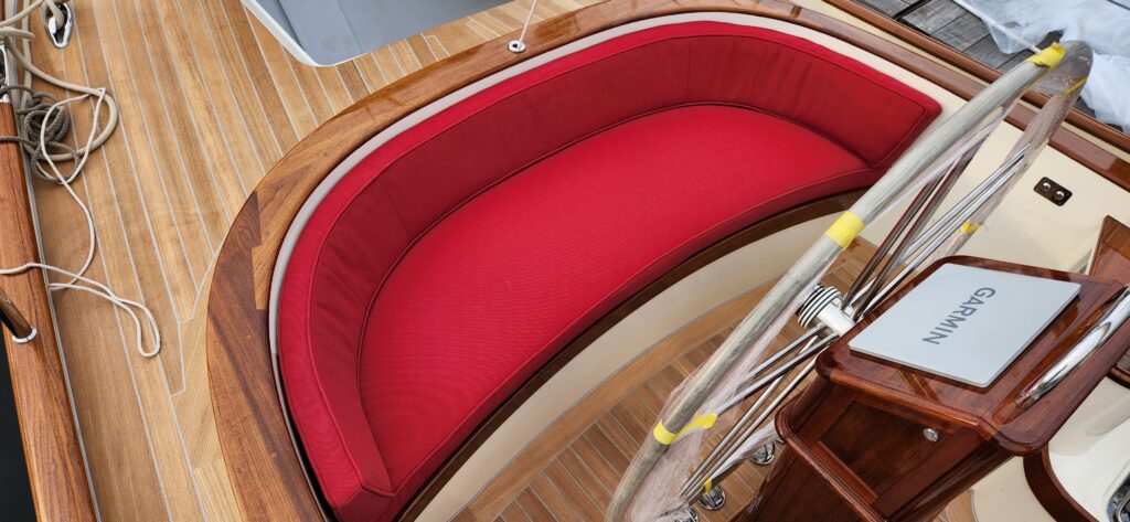 Bright red curved helm bench.